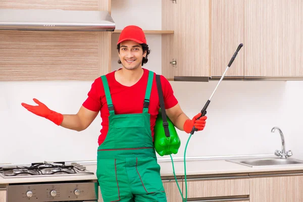 Professional contractor doing pest control at kitchen — Stock Photo, Image