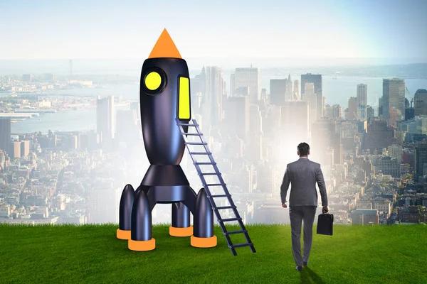Young businessman boarding space rocket in start-up concept — Stock Photo, Image