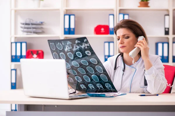 Aged female doctor radiologist in the clinic