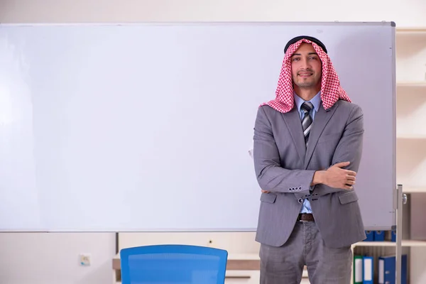 Young handsome arab teacher wearing suit — Stock Photo, Image