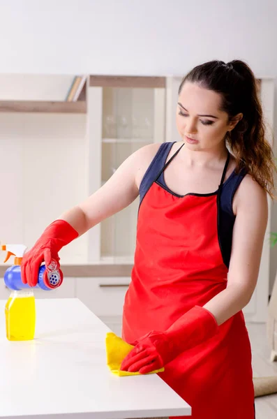 Young beautiful woman cleaning apartment — Stock Photo, Image