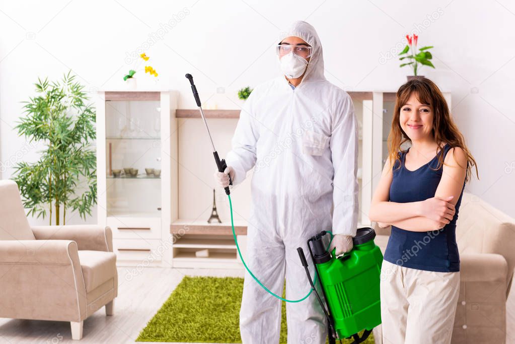 Young professional contractor doing pest control at flat 