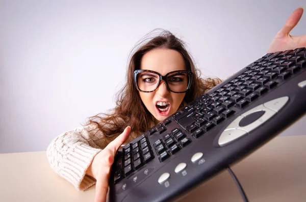 Funny nerd girl working on computer — Stock Photo, Image