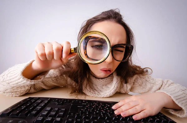 Funny nerd girl working on computer Royalty Free Stock Photos