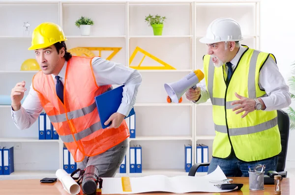 Two engineers colleagues working under project — Stock Photo, Image