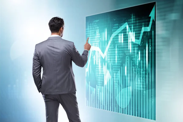 Businessman in futuristic stock trading concept — Stock Photo, Image