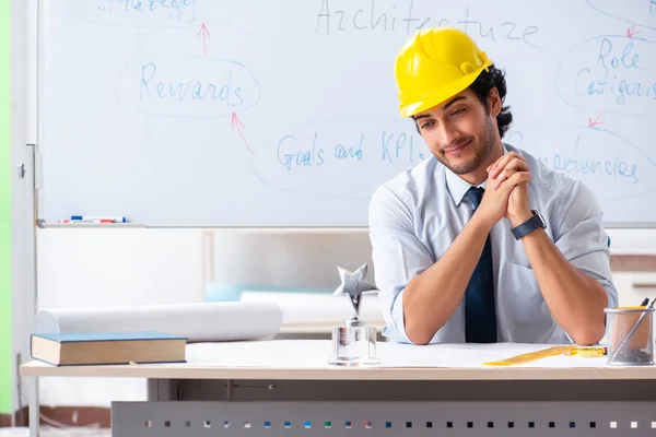 Young male architect in front of the whiteboard — Stock Photo, Image