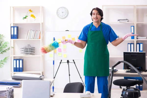 Male handsome professional cleaner working in the office — Stock Photo, Image