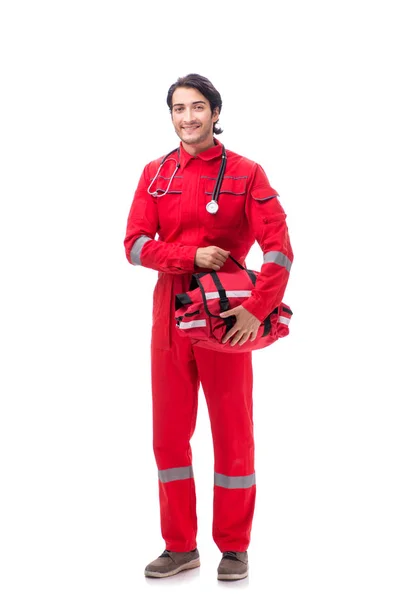 Jonge paramedicus in rode uniform geïsoleerd op wit — Stockfoto
