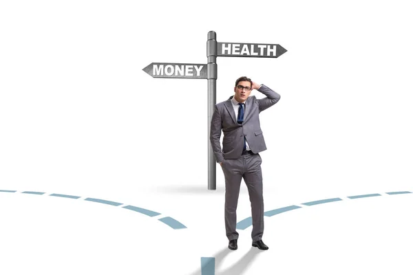Businessman choosing between money and health — Stock Photo, Image
