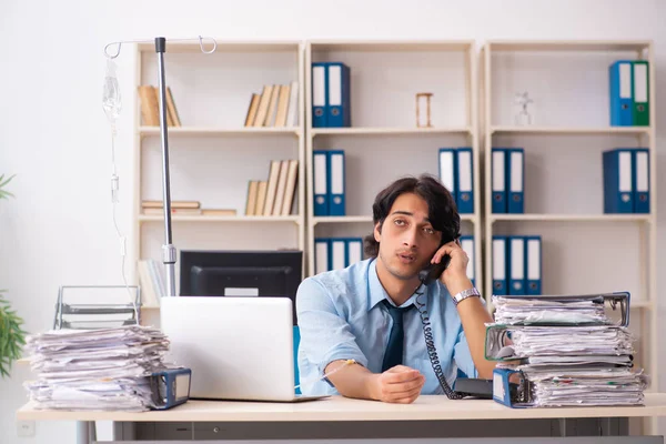 Young male employee in blood transfusion concept — Stock Photo, Image