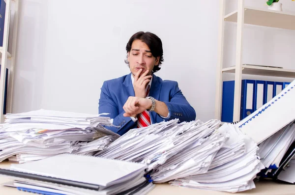 Young businessman employee unhappy with excessive work — Stock Photo, Image