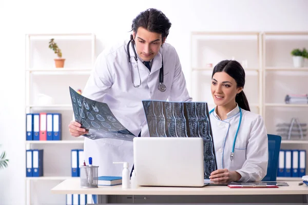 Two young doctors working in the clinic — Stock Photo, Image