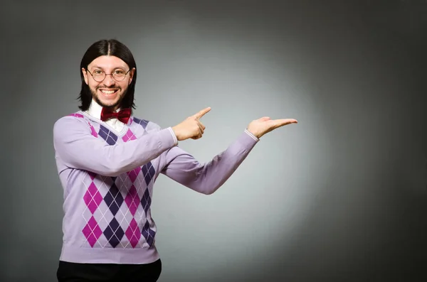 Young man wearing pullover on grey background — Stock Photo, Image