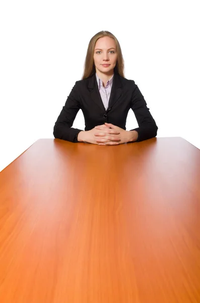 Empregada feminina sentada em mesa longa isolada em branco — Fotografia de Stock