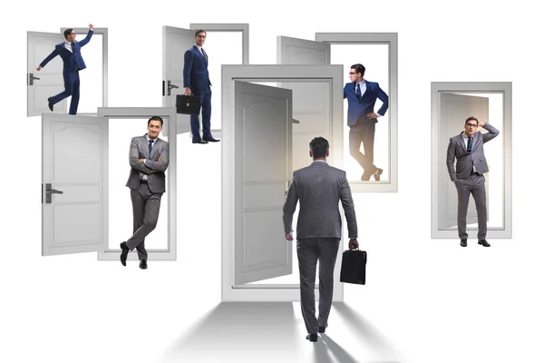 Businessman in uncertainty concept with many doors — Stock Photo, Image