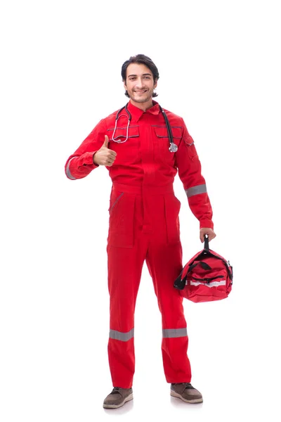 Junger Sanitäter in roter Uniform isoliert auf weißem Grund — Stockfoto