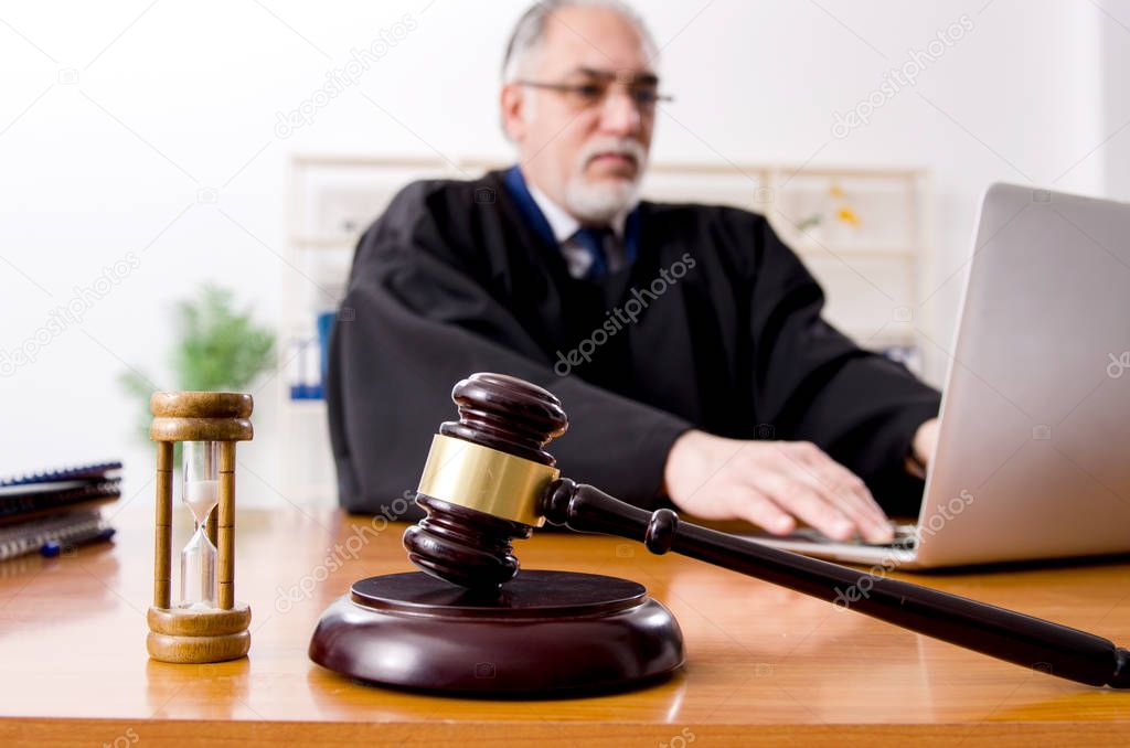 Aged lawyer working in the courthouse  