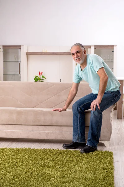 White bearded old man suffering at home — Stock Photo, Image