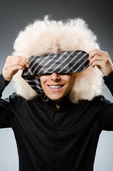 Young man wearing afro wig — Stock Photo, Image