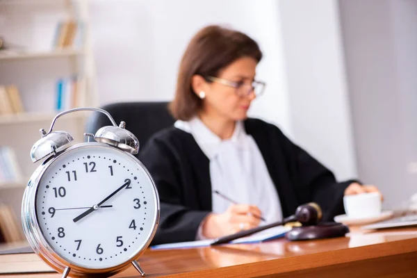 Middle-aged female doctor working in courthouse — Stock Photo, Image