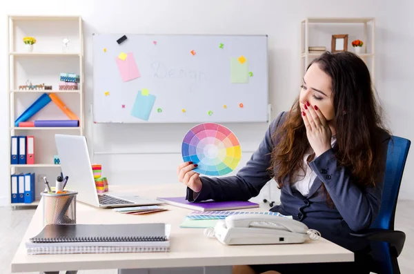 Young female designer working in the office — Stock Photo, Image