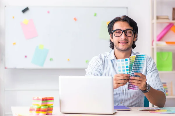 Young handsome male designer working in the office — Stock Photo, Image