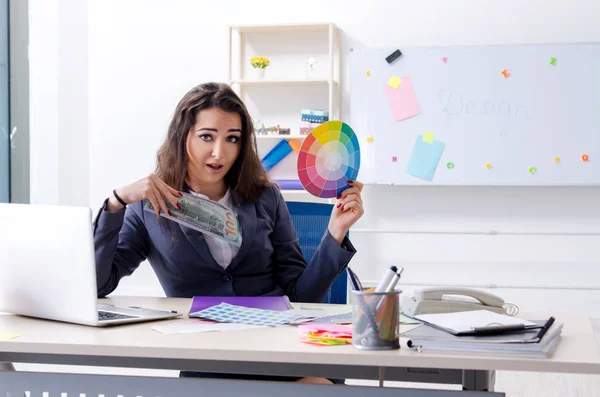 Young female designer working in the office — Stock Photo, Image