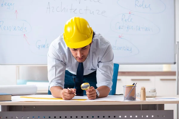 Young male architect in front of the whiteboard — Stock Photo, Image