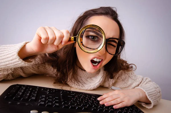 Funny nerd girl working on computer Stock Picture