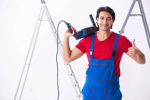 Young handsome contractor working indoors — Stock Photo, Image