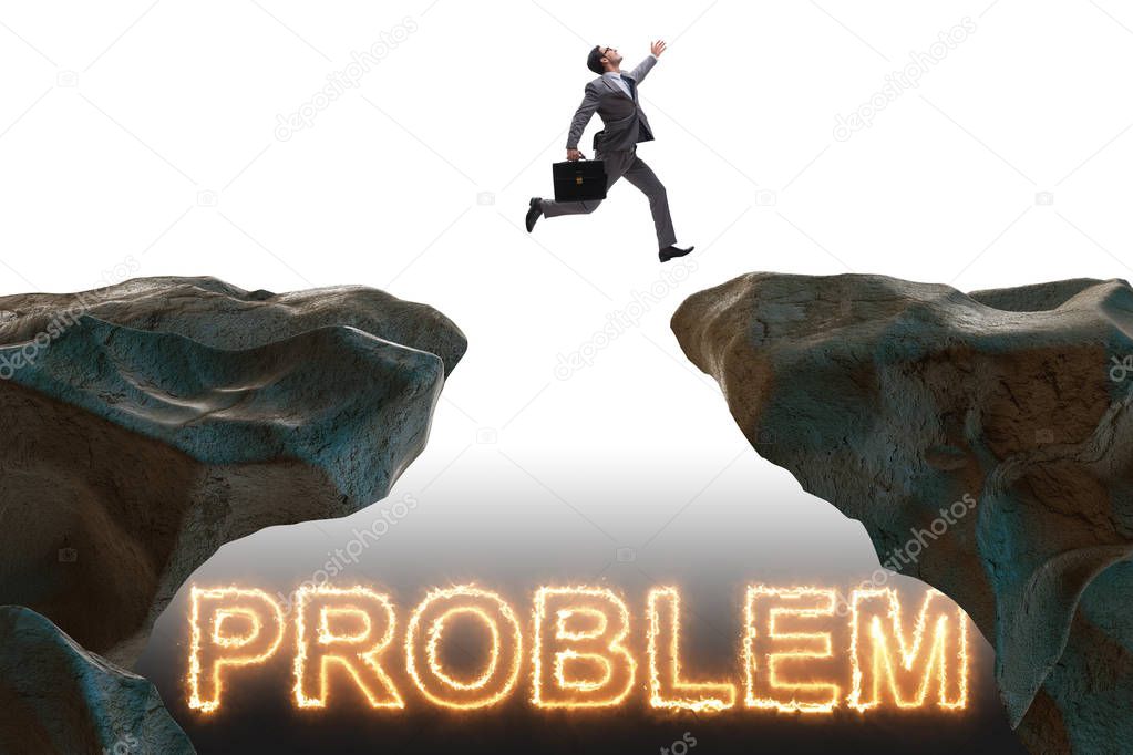 Businessman jumping over burning problems