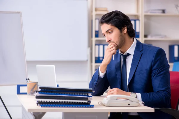 Young handsome businessman working in the office — Stock Photo, Image