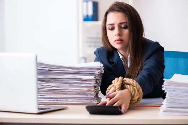 Young beautiful employee tied up with rope in the office — Stock Photo, Image