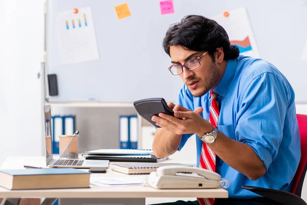 Young male financial manager working in the office — Stock Photo, Image