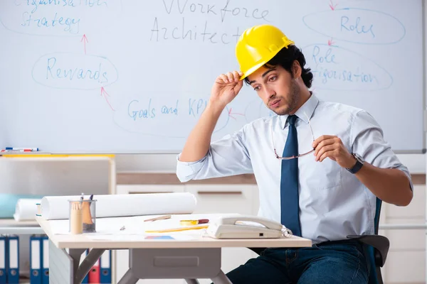 Young male architect in front of the whiteboard — Stock Photo, Image