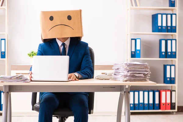 Unhappy man employee with box instead of his head — Stock Photo, Image