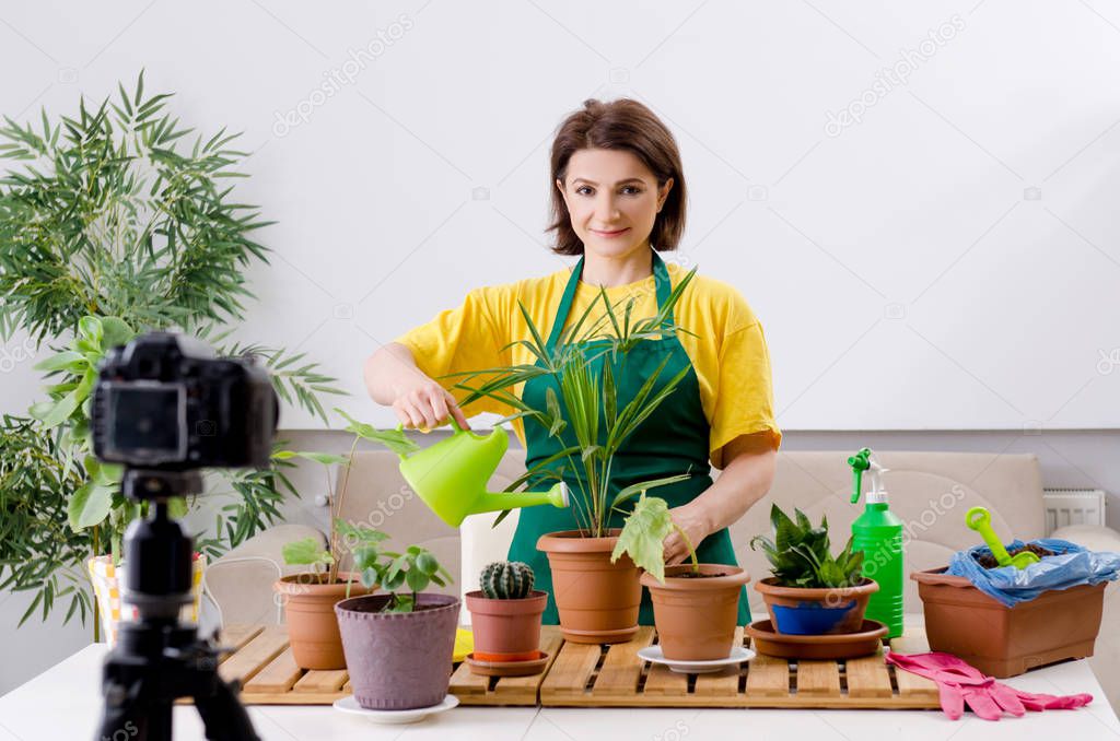 Female blogger explaining houseplants growing 