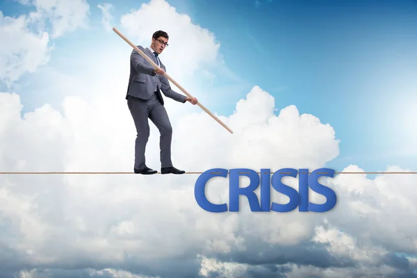 Crisis concept with businessman walking on tight rope — Stock Photo, Image