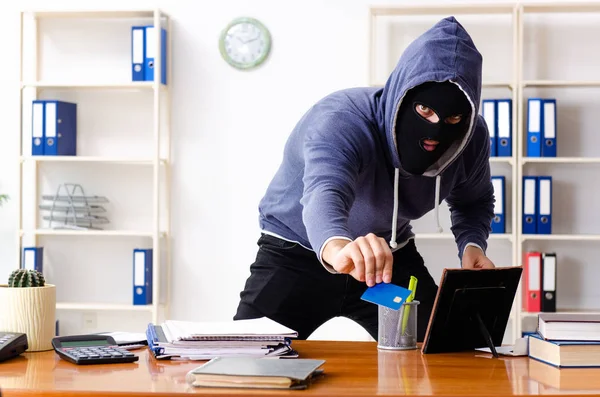 Male thief in balaclava in the office — Stock Photo, Image