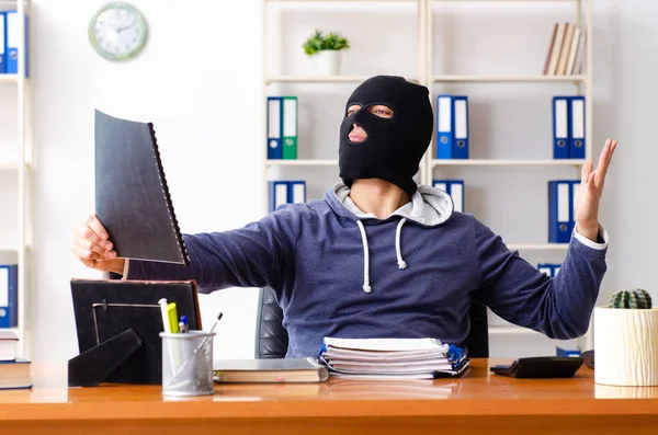 Male thief in balaclava in the office — Stock Photo, Image