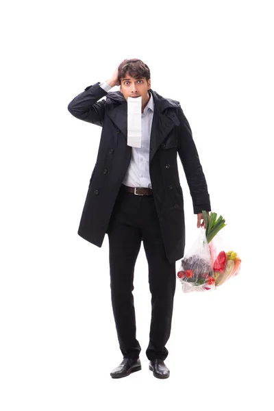 Jeune homme beau avec des légumes dans le concept de shopping — Photo