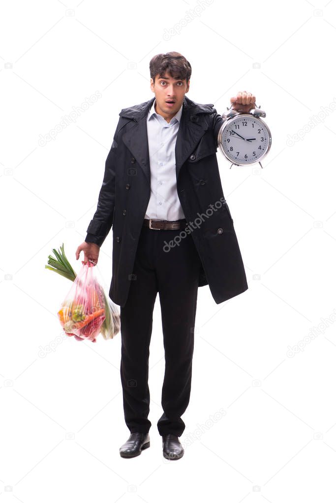 Young handsome man with vegatables in shopping concept 