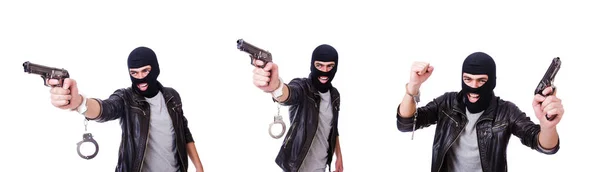 Mann mit Waffe und Handschellen auf weiß — Stockfoto