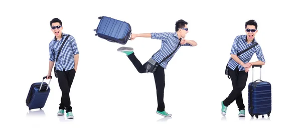 Νεαρός με ταξιδιωτική βαλίτσα στα λευκά — Φωτογραφία Αρχείου