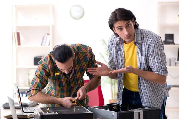 IT engineers working on hardware issue