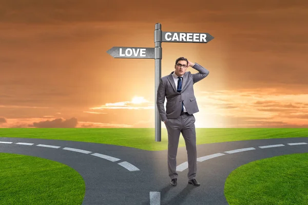 Businessman having hard choice between love and career — Stock Photo, Image