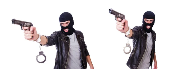 Человек с пистолетом и наручниками на белом — стоковое фото