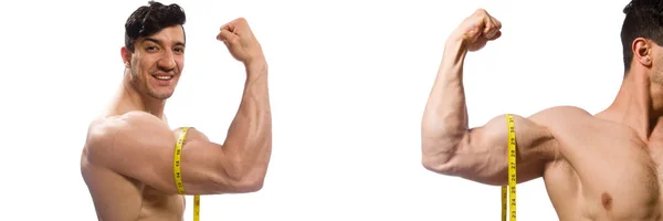 Hombre musculoso midiendo sus músculos — Foto de Stock