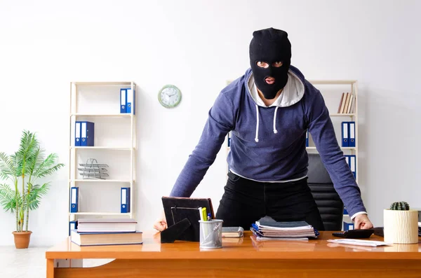 Male thief in balaclava in the office — Stock Photo, Image